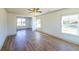 Spacious living room with hardwood floors and large windows at 5470 Crow Dr, Cumming, GA 30041