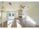 Bright living room with hardwood floors, stone fireplace and large windows at 5470 Crow Dr, Cumming, GA 30041