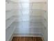 Walk-in pantry with wire shelving for convenient storage at 5470 Crow Dr, Cumming, GA 30041