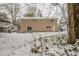House backyard in winter with snow on the ground at 6695 Buckhurst Trl, Atlanta, GA 30349
