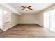 Spacious basement with sliding glass doors and wood flooring at 6695 Buckhurst Trl, Atlanta, GA 30349