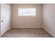 Simple bedroom with carpet, window, and closet at 6695 Buckhurst Trl, Atlanta, GA 30349