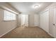 Spacious bedroom with carpet, double closets and access to another room at 6695 Buckhurst Trl, Atlanta, GA 30349