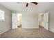 Large bedroom with neutral walls, carpeting and access to a loft at 6695 Buckhurst Trl, Atlanta, GA 30349