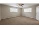 Bright bedroom with neutral walls and plush carpeting at 6695 Buckhurst Trl, Atlanta, GA 30349