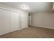 Bright bedroom with carpet and double closets at 6695 Buckhurst Trl, Atlanta, GA 30349