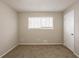 Bright bedroom with neutral walls and plush carpeting at 6695 Buckhurst Trl, Atlanta, GA 30349