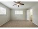 Spacious bedroom with neutral walls and plush carpeting at 6695 Buckhurst Trl, Atlanta, GA 30349