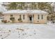 Ranch style home with snow covered yard at 6695 Buckhurst Trl, Atlanta, GA 30349