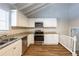 Modern kitchen with granite countertops and stainless steel appliances at 6695 Buckhurst Trl, Atlanta, GA 30349