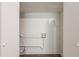 Small laundry room with hookups and storage at 6695 Buckhurst Trl, Atlanta, GA 30349