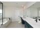 Modern bathroom with double vanity and soaking tub at 5435 Crestline View Rd, Cumming, GA 30028