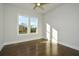Spacious bedroom with hardwood floors and large window at 5435 Crestline View Rd, Cumming, GA 30028