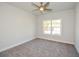 Bright bedroom with window and ceiling fan at 5435 Crestline View Rd, Cumming, GA 30028