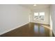 Spacious bedroom with hardwood floors and large windows at 5435 Crestline View Rd, Cumming, GA 30028