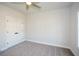 Spacious bedroom with double doors and ceiling fan at 5435 Crestline View Rd, Cumming, GA 30028