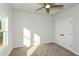Well-lit bedroom with window and ceiling fan at 5435 Crestline View Rd, Cumming, GA 30028
