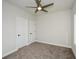 Bright bedroom with double door closets and ceiling fan at 5435 Crestline View Rd, Cumming, GA 30028