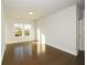 Bright bedroom featuring hardwood floors and natural light at 5435 Crestline View Rd, Cumming, GA 30028