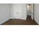 Bedroom with hardwood floors and access to hallway at 5435 Crestline View Rd, Cumming, GA 30028