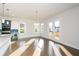 Sunlit dining room with hardwood floors and access to a deck at 5435 Crestline View Rd, Cumming, GA 30028