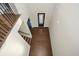 Two-story entryway with hardwood floors and a view of the staircase and front door at 5435 Crestline View Rd, Cumming, GA 30028