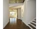 Two-story entryway with hardwood floors, high ceilings, and a view to the living room at 5435 Crestline View Rd, Cumming, GA 30028