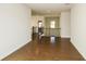 Upstairs hallway with hardwood floors and access to bedrooms at 5435 Crestline View Rd, Cumming, GA 30028