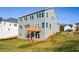 Gray house exterior with a deck and a large yard at 5435 Crestline View Rd, Cumming, GA 30028
