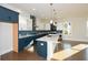 Modern kitchen with white and blue cabinets and a large island at 5435 Crestline View Rd, Cumming, GA 30028
