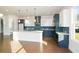 Modern kitchen with white and blue cabinets and a large island at 5435 Crestline View Rd, Cumming, GA 30028