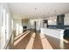 Modern kitchen with white and blue cabinets, an island, and hardwood floors at 5435 Crestline View Rd, Cumming, GA 30028