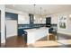 Modern kitchen with white and blue cabinets and a large island at 5435 Crestline View Rd, Cumming, GA 30028