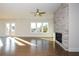 Spacious living room featuring hardwood floors, fireplace and a view at 5435 Crestline View Rd, Cumming, GA 30028