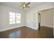 Spacious office with hardwood floors, built-in shelving, and French doors at 5435 Crestline View Rd, Cumming, GA 30028