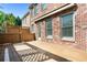 Lovely back deck featuring wood material and brick exterior of home at 570 Parkside Village Nw Way # 12, Marietta, GA 30060