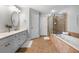 Bathroom featuring double sinks, soaking tub, and walk in shower at 570 Parkside Village Nw Way # 12, Marietta, GA 30060