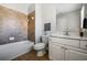 Cozy bathroom featuring modern vanity and tiled shower and tub at 570 Parkside Village Nw Way # 12, Marietta, GA 30060