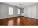 Bedroom includes wood floors, natural lighting, and closet shelving at 570 Parkside Village Nw Way # 12, Marietta, GA 30060
