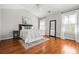 Bedroom features wood flooring, a decorative rug, and white walls at 570 Parkside Village Nw Way # 12, Marietta, GA 30060