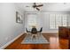 Charming breakfast nook with bright windows, a modern light fixture, and an adjacent view into the kitchen at 570 Parkside Village Nw Way # 12, Marietta, GA 30060