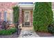 Charming entrance featuring a brick facade, stone walkway and manicured landscaping at 570 Parkside Village Nw Way # 12, Marietta, GA 30060