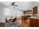 Bright kitchen featuring stainless steel appliances, granite countertops, a breakfast nook, and beautiful wood cabinets at 570 Parkside Village Nw Way # 12, Marietta, GA 30060