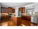 Spacious kitchen with granite countertops, stainless steel appliances, a kitchen island, and hardwood floors at 570 Parkside Village Nw Way # 12, Marietta, GA 30060