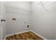 Laundry room includes overhead shelving and wood flooring at 570 Parkside Village Nw Way # 12, Marietta, GA 30060