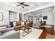 Open-concept living room with hardwood floors flowing into a dining area, great for entertaining at 570 Parkside Village Nw Way # 12, Marietta, GA 30060