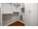 White walk in closet with wood flooring and shelving at 570 Parkside Village Nw Way # 12, Marietta, GA 30060