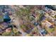 Aerial view showing a house's location within a wooded neighborhood at 7825 Brands Hatch Blvd, Cumming, GA 30040