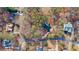 Aerial view of a house and lot surrounded by trees at 7825 Brands Hatch Blvd, Cumming, GA 30040