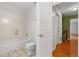 Simple bathroom with shower/tub combo and tile floors at 7825 Brands Hatch Blvd, Cumming, GA 30040